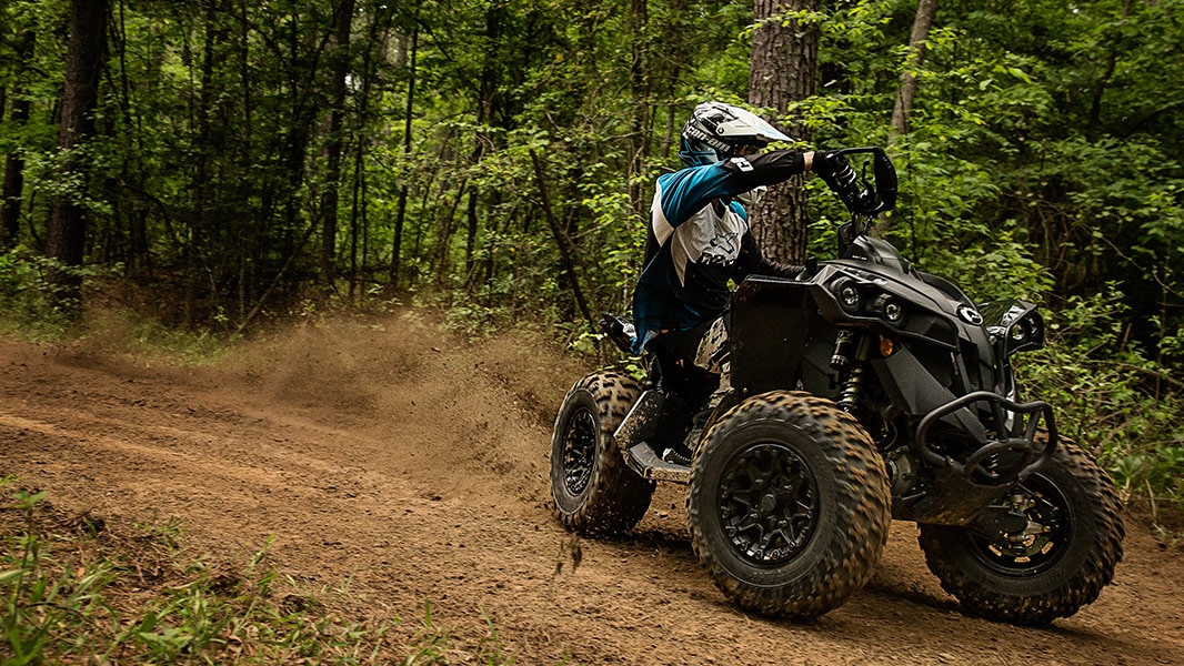 Man drifting on a muddy trail with his Can-Am Renegade 
