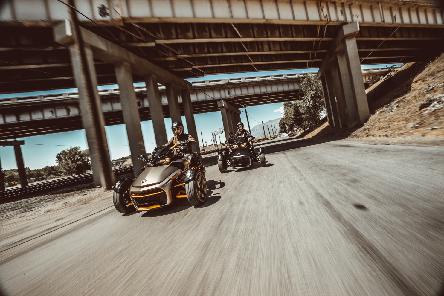 Three friends driving their Spyder F3 on a motorway