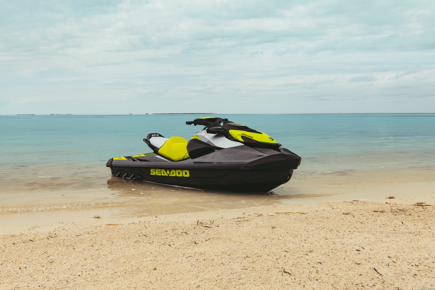 A Sea-Doo GTR parked on the sand of a beach