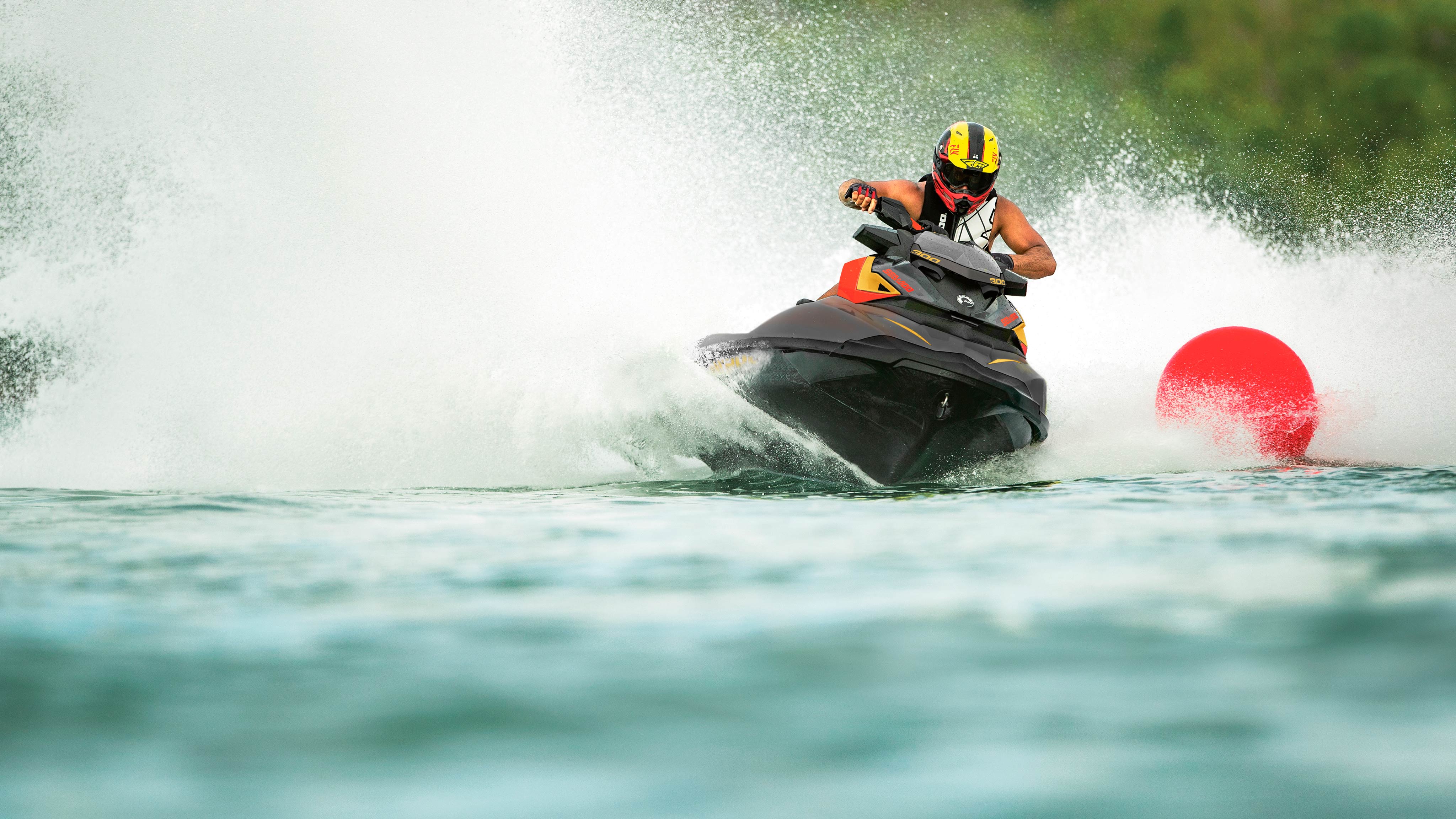 Man wearing helmet riding his Sea-Doo RXP-X