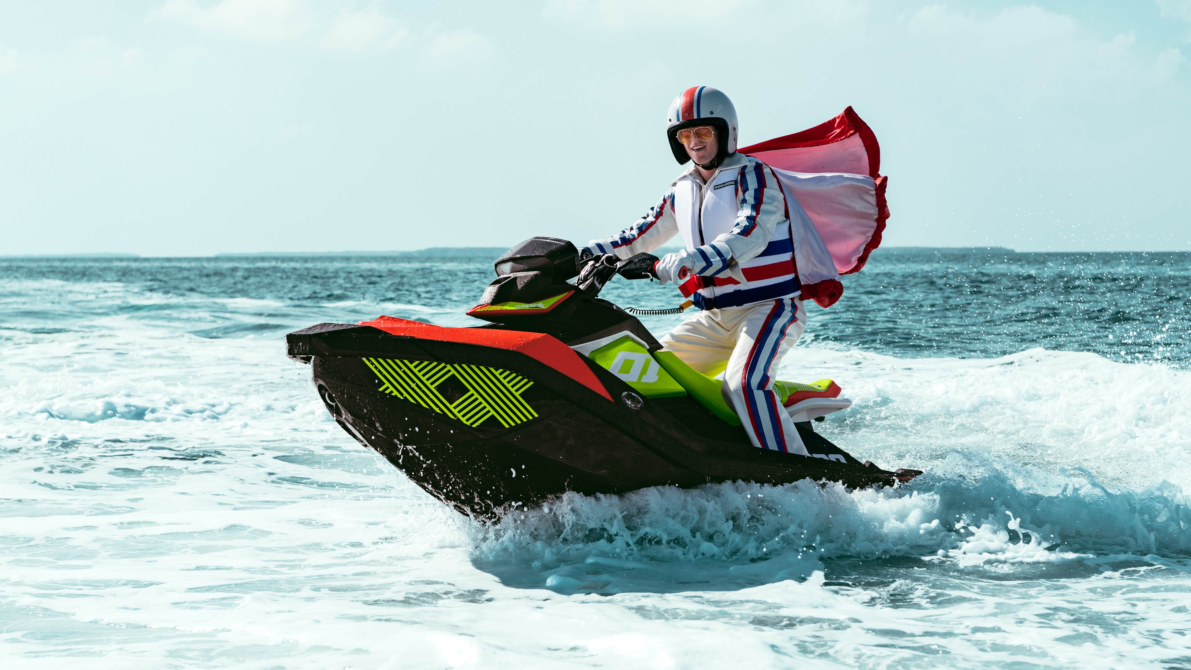 Costumed man standing up on his Sea-Doo Spark Trixx