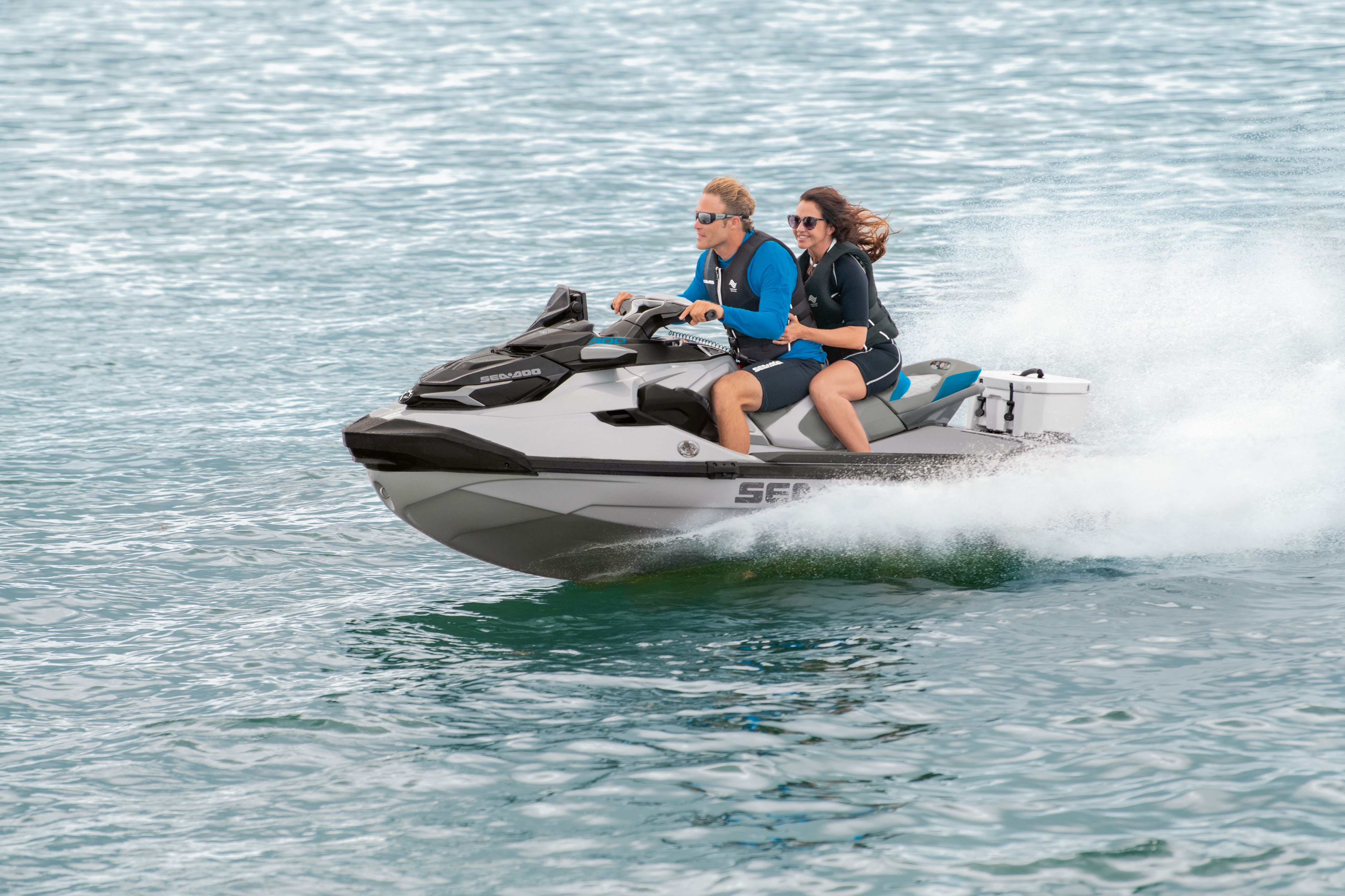 Wide shot of man and woman riding a Sea-Doo GTX LTD