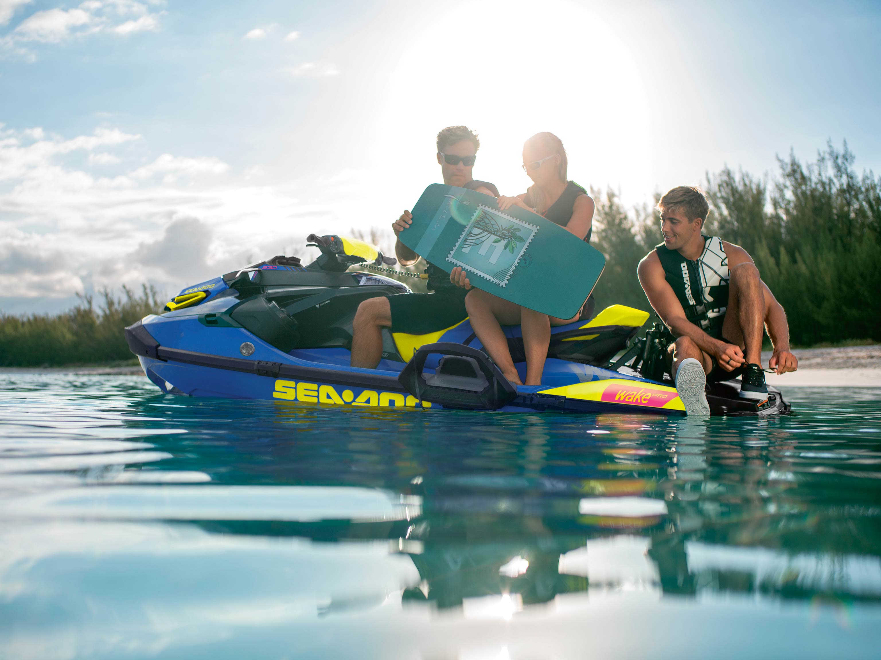 Group of three relaxing on a Sea-Doo Wake Pro