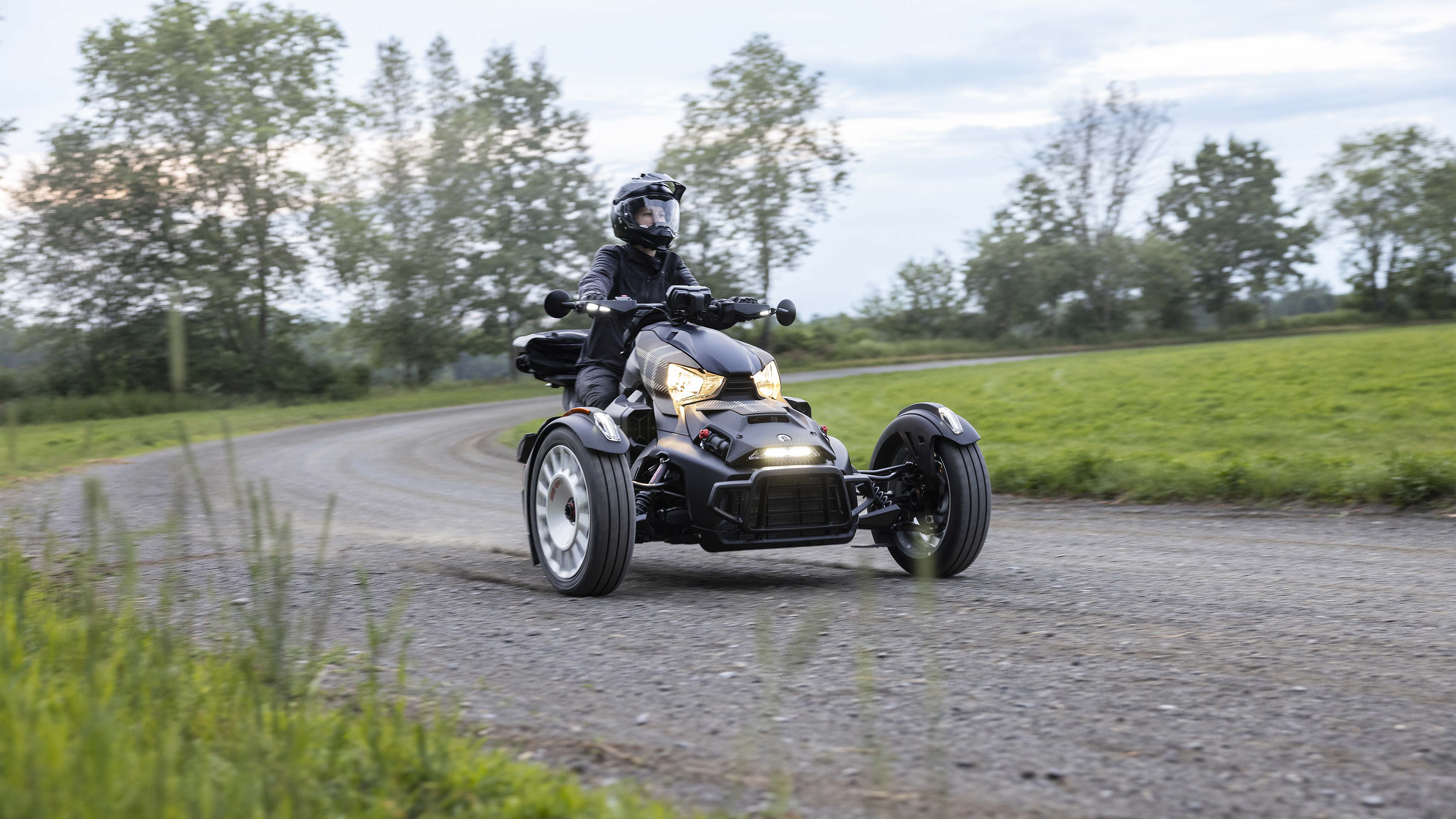 A Can-Am Ryker 2025 3-wheel motorcycle on an unpaved road