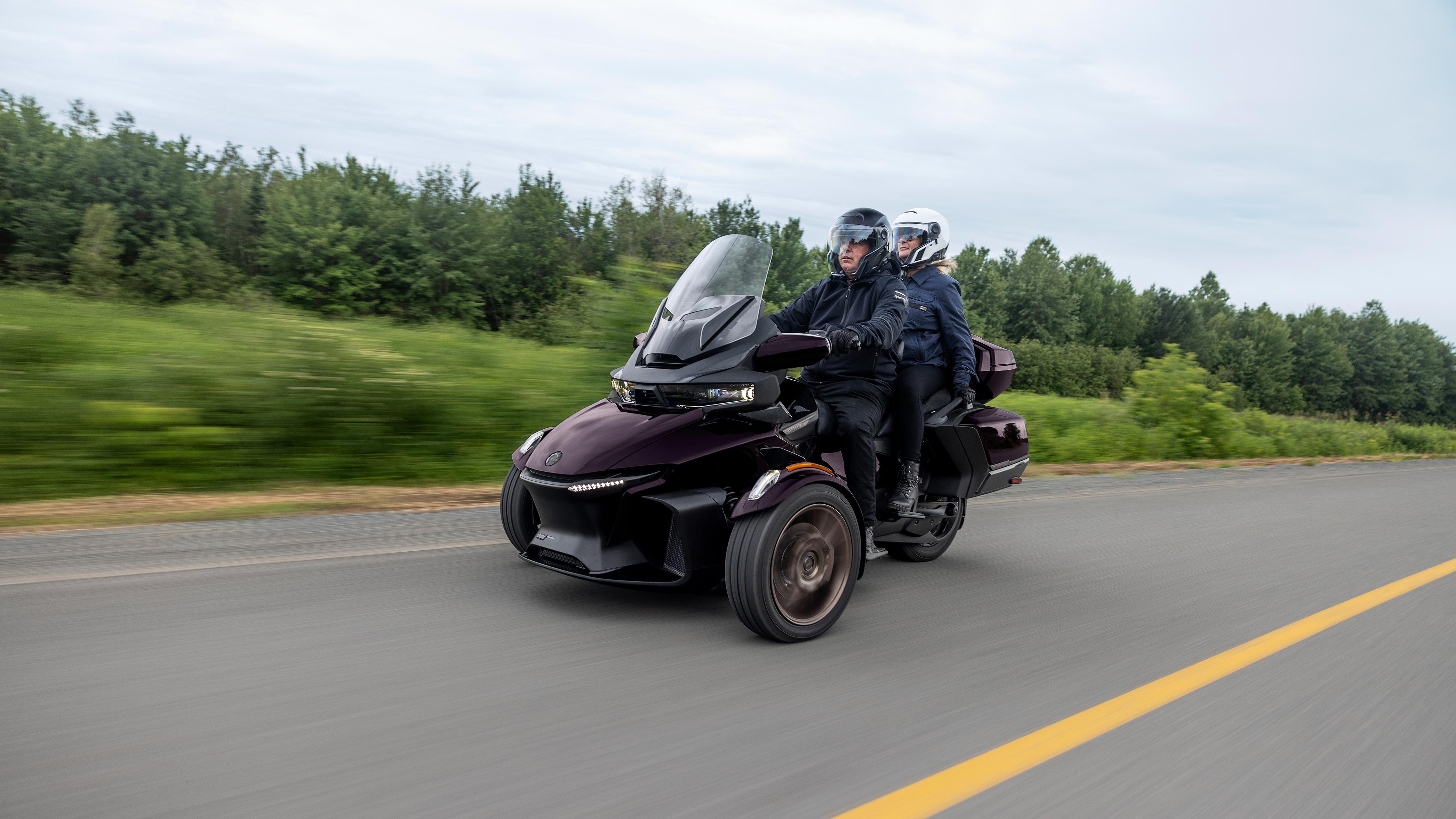 Two riders on a nice road on their 2025 Can-Am Spyder RT