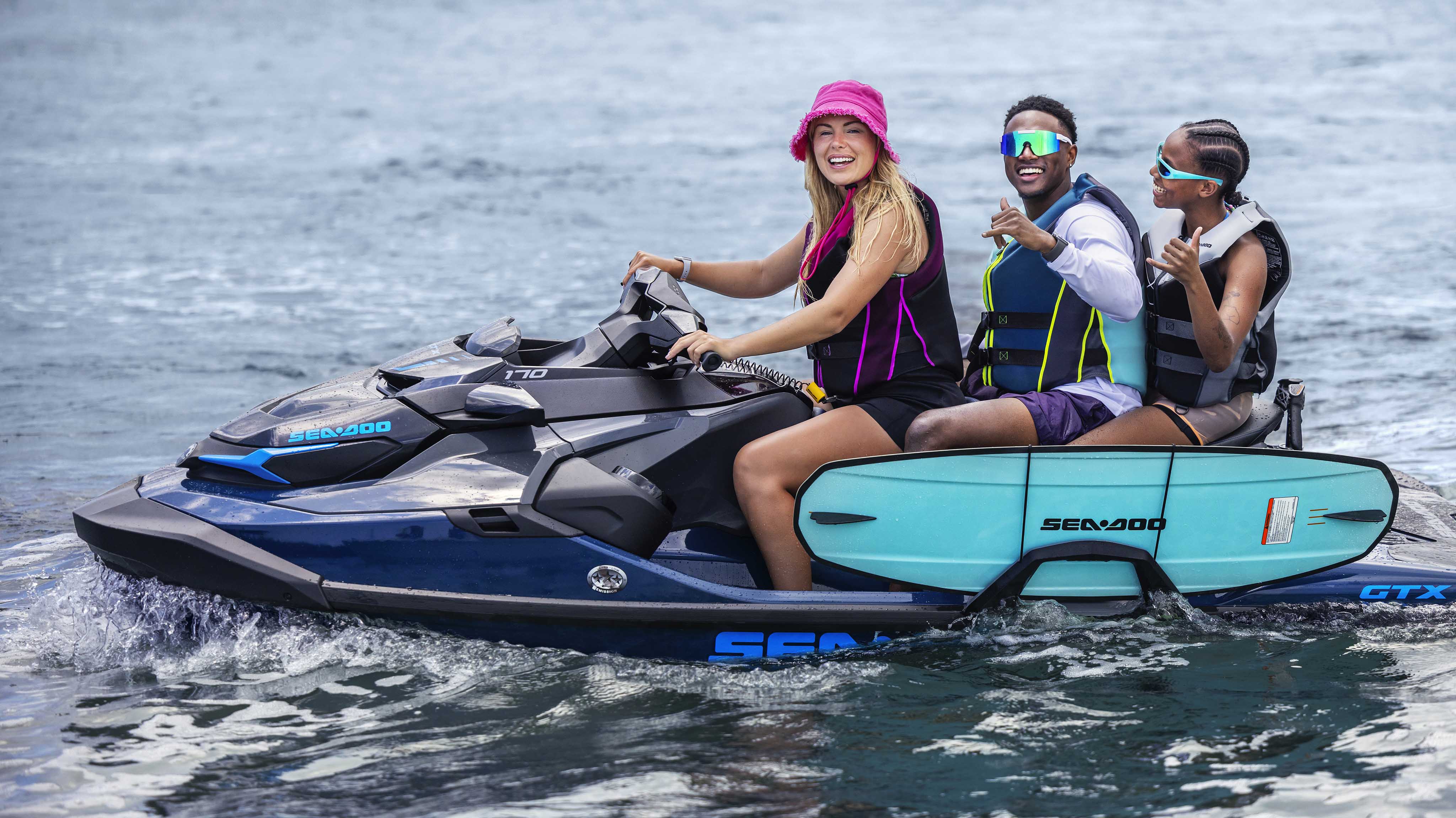 Three friends on a Sea-Doo GTX personal watercraft