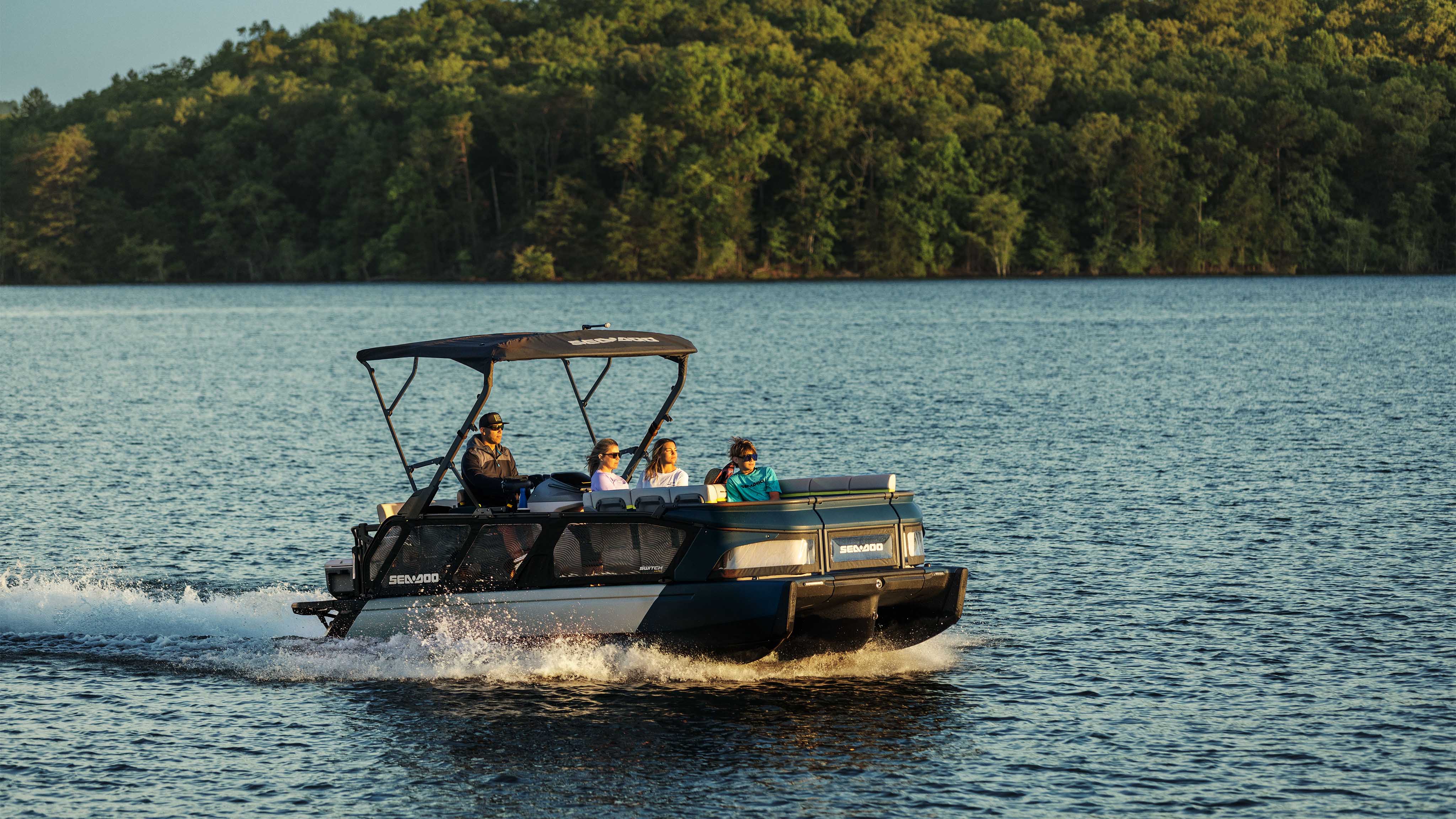 Family riding a Sea-Doo Switch Cruise Limited pontoon