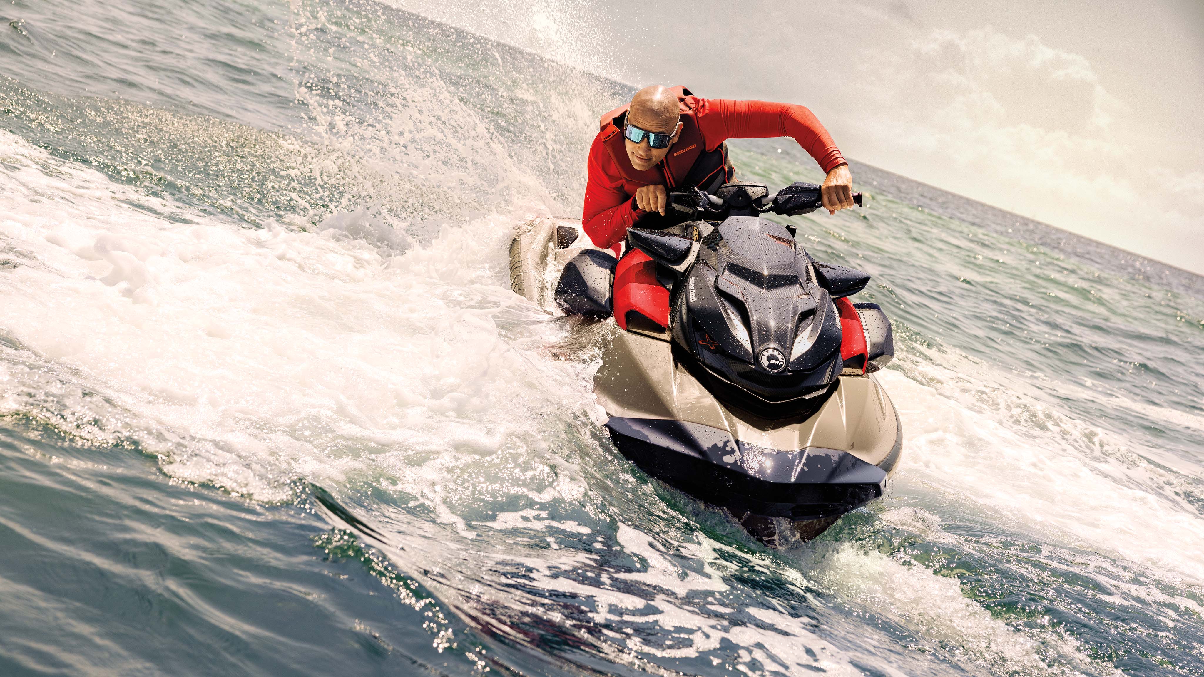 Man riding a Sea-Doo RXP-X personal watercraft