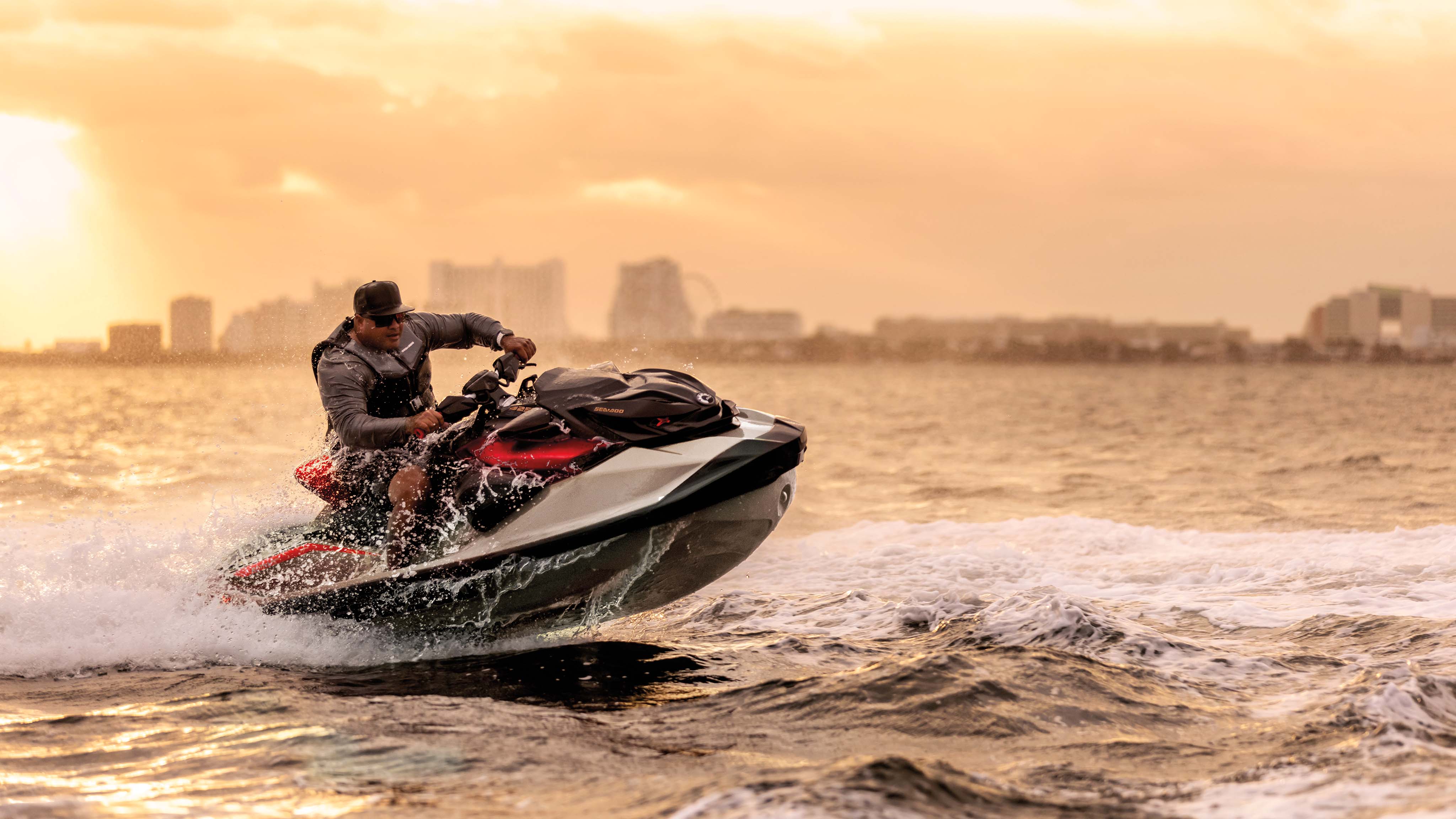 Man sitting on an idle Sea-Doo RXP-X personal watercraft