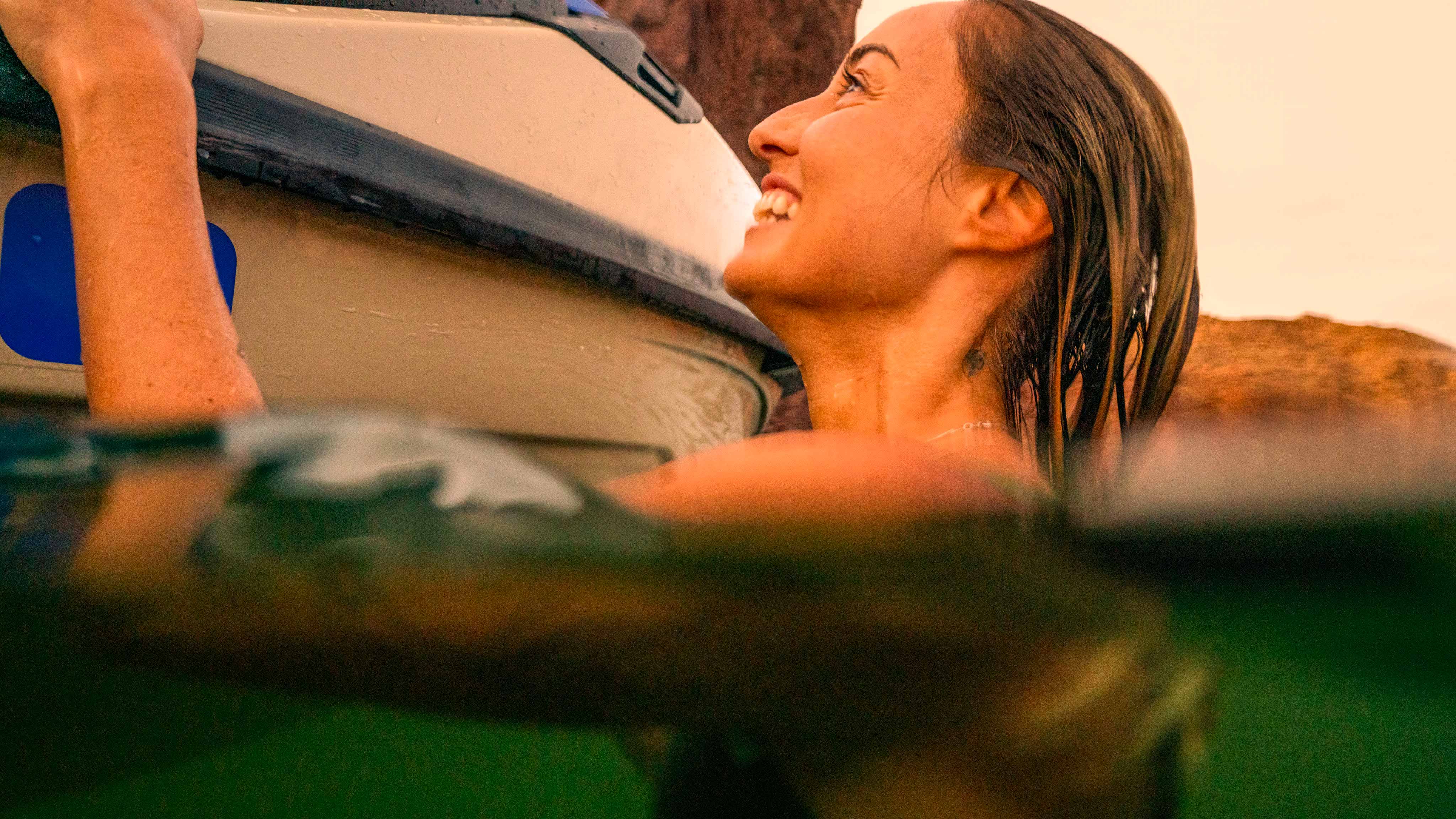 Woman pulling off a trick on a Sea-Doo Spark Trixx personal watercraft