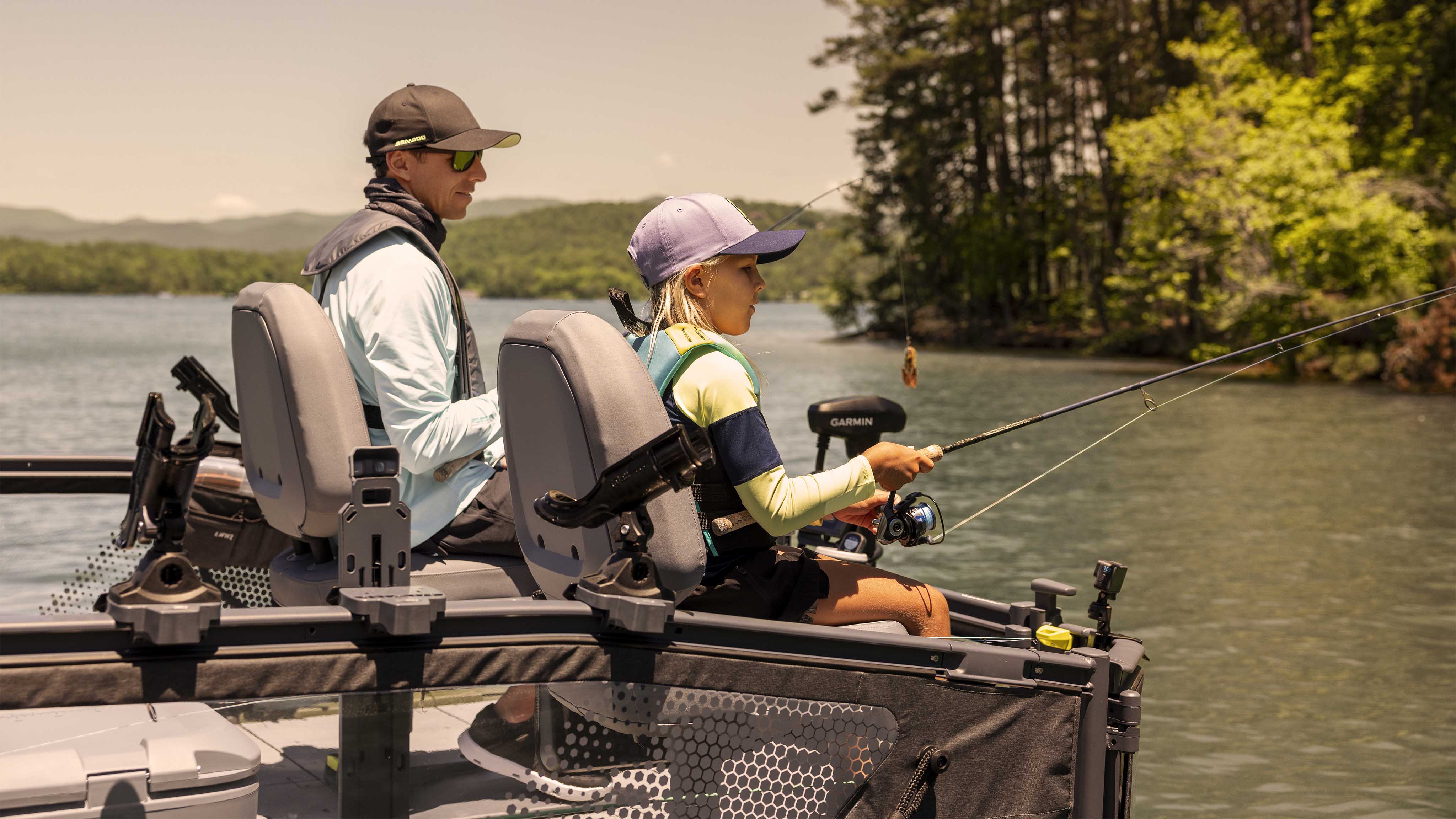 Family having fun on a 2024 Sea-Doo Switch Cruise Limited pontoon boat