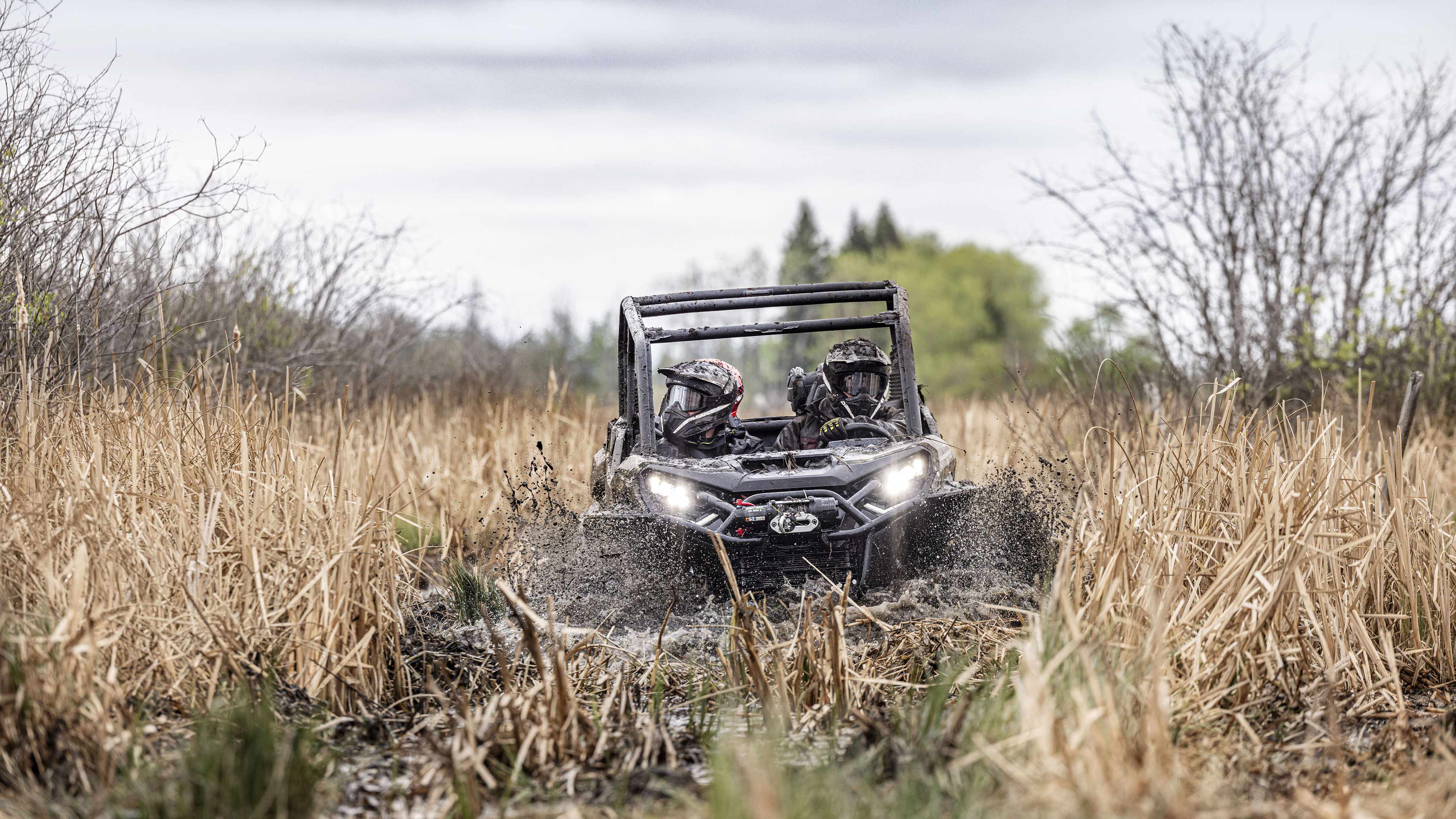 2024 Can-Am Commander riding in deep mud