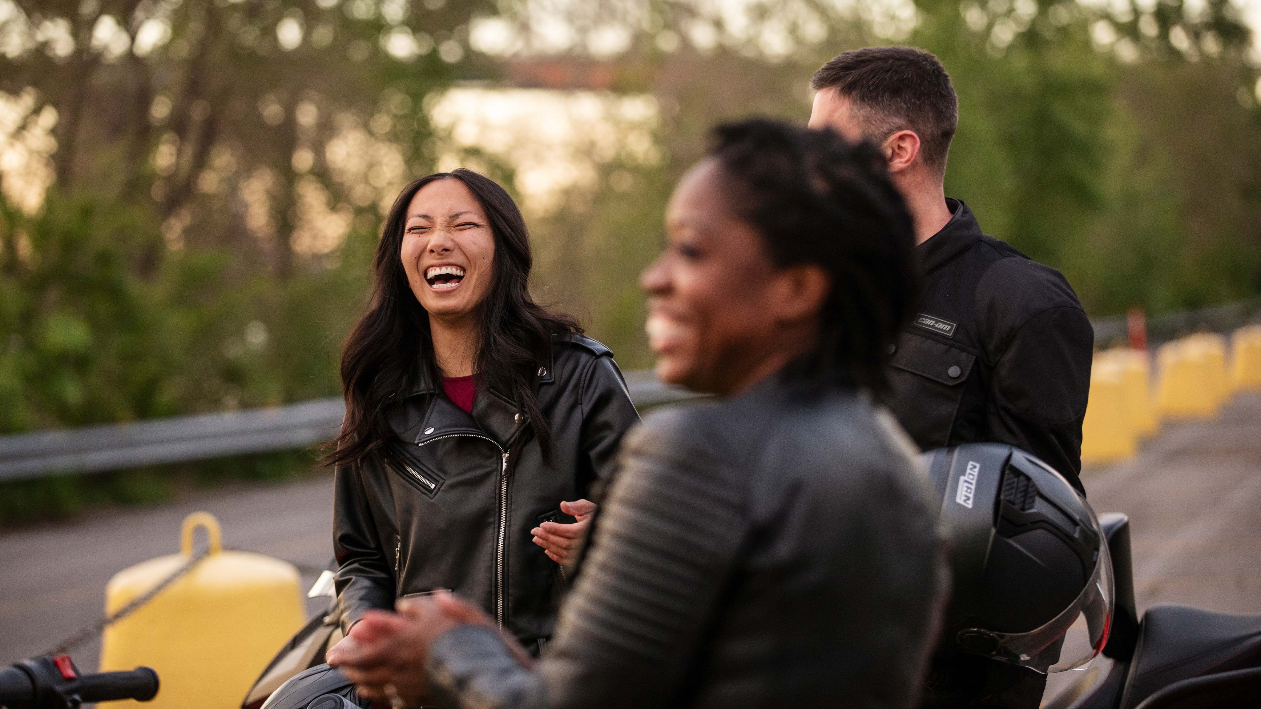 Group of Can-Am riders laughing together